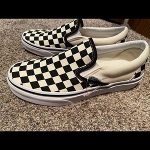Vans checkerboard slide on’s.